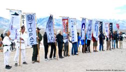 Banners representing all ten War Relocation Authority concentration camps, along with the 100th/442nd MIS, shown here during the 47th Annual Manzanar Pilgrimage, April 30, 2016, Manzanar National Historic Site.