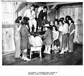 Manzanar's music teacher, Lou Frizsel with his students.