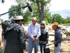 Henry, with Arthur Ogami (left) and his wife, Kimi, discussing their experiences at Manzanar.